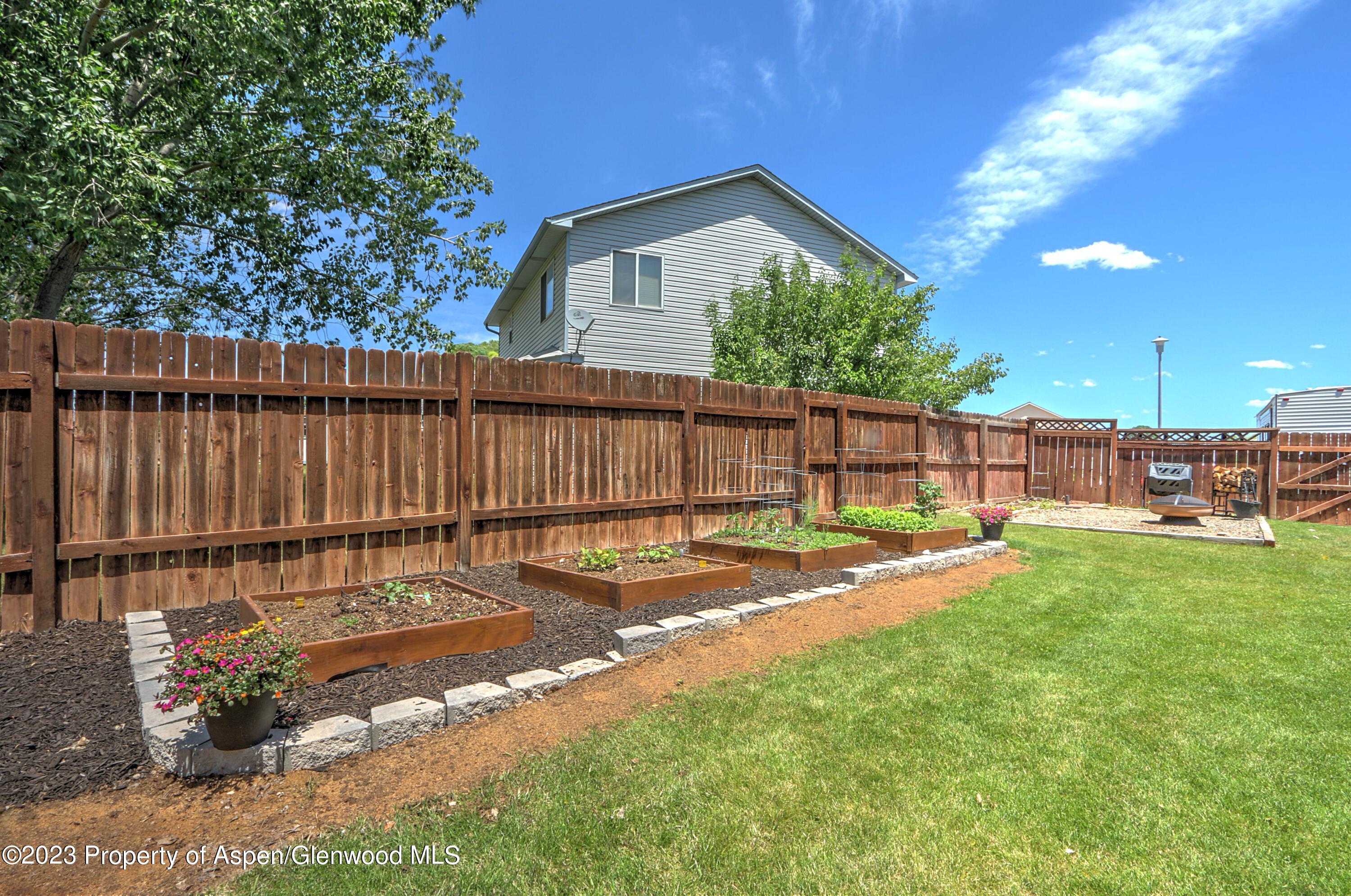 1527 Graham Court Rifle, CO 81650 - Photo 29 of 32 a view of a backyard with a tub