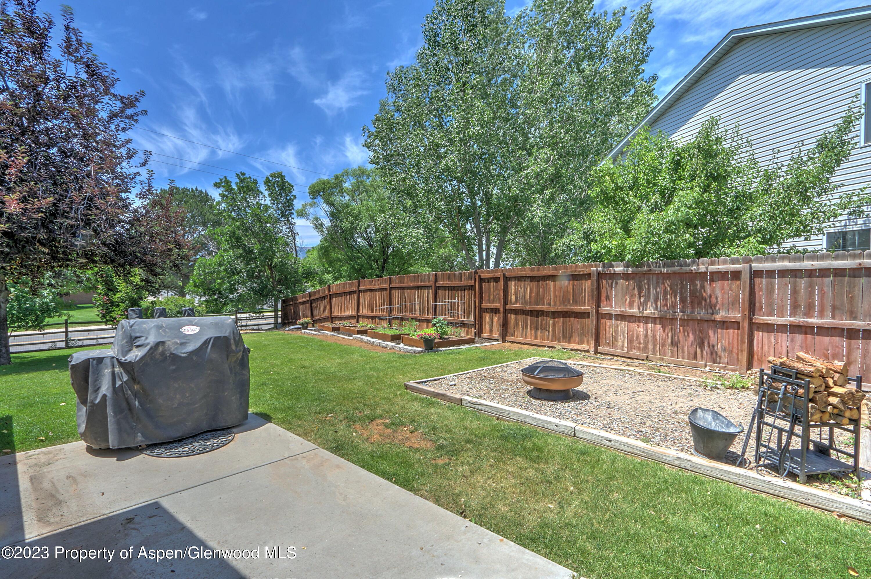 1527 Graham Court Rifle, CO 81650 - Photo 31 of 32 a view of a backyard with sitting area and furniture