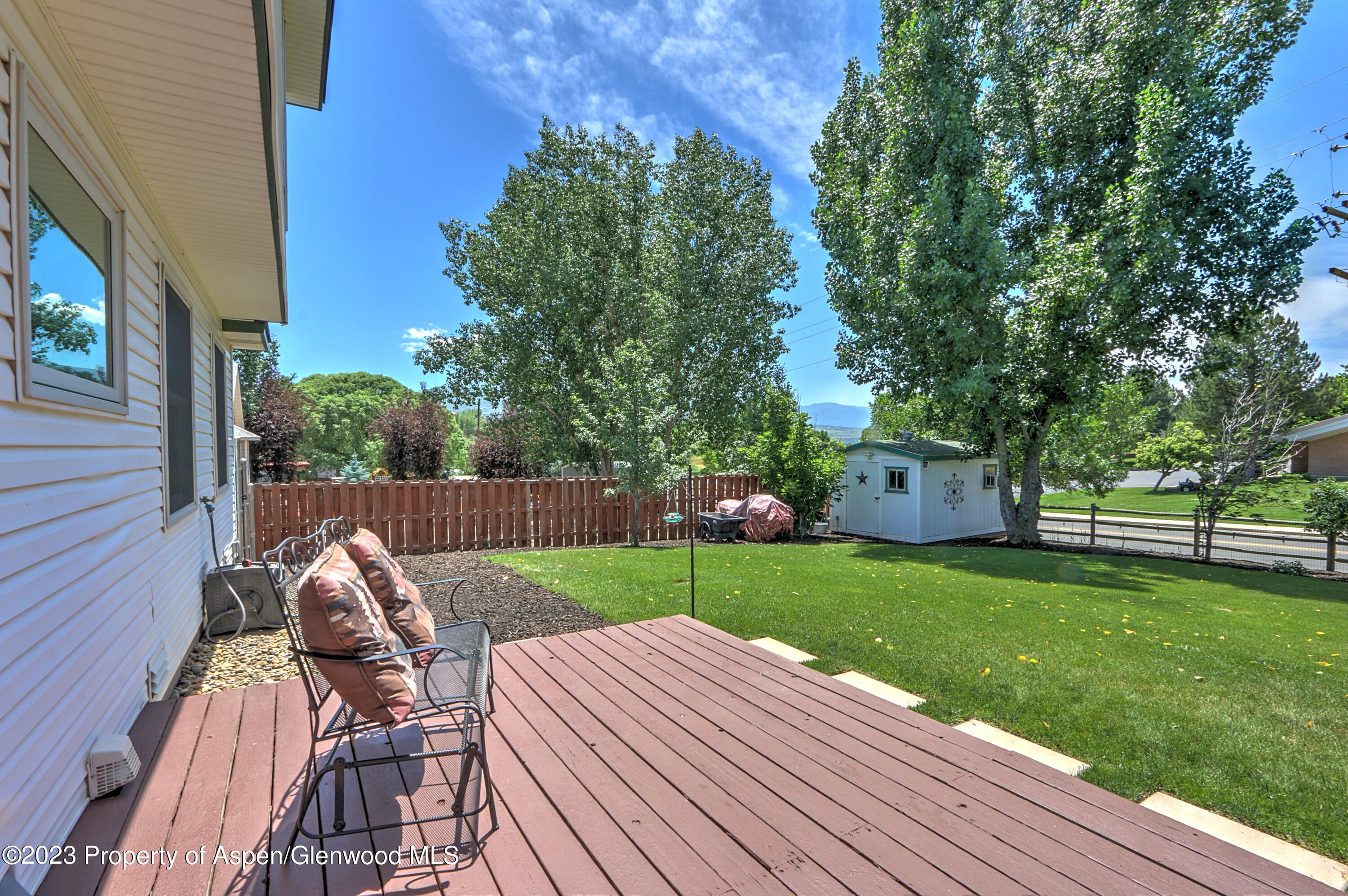 1527 Graham Court Rifle, CO 81650 - Photo 32 of 32 a view of backyard with seating area and green space