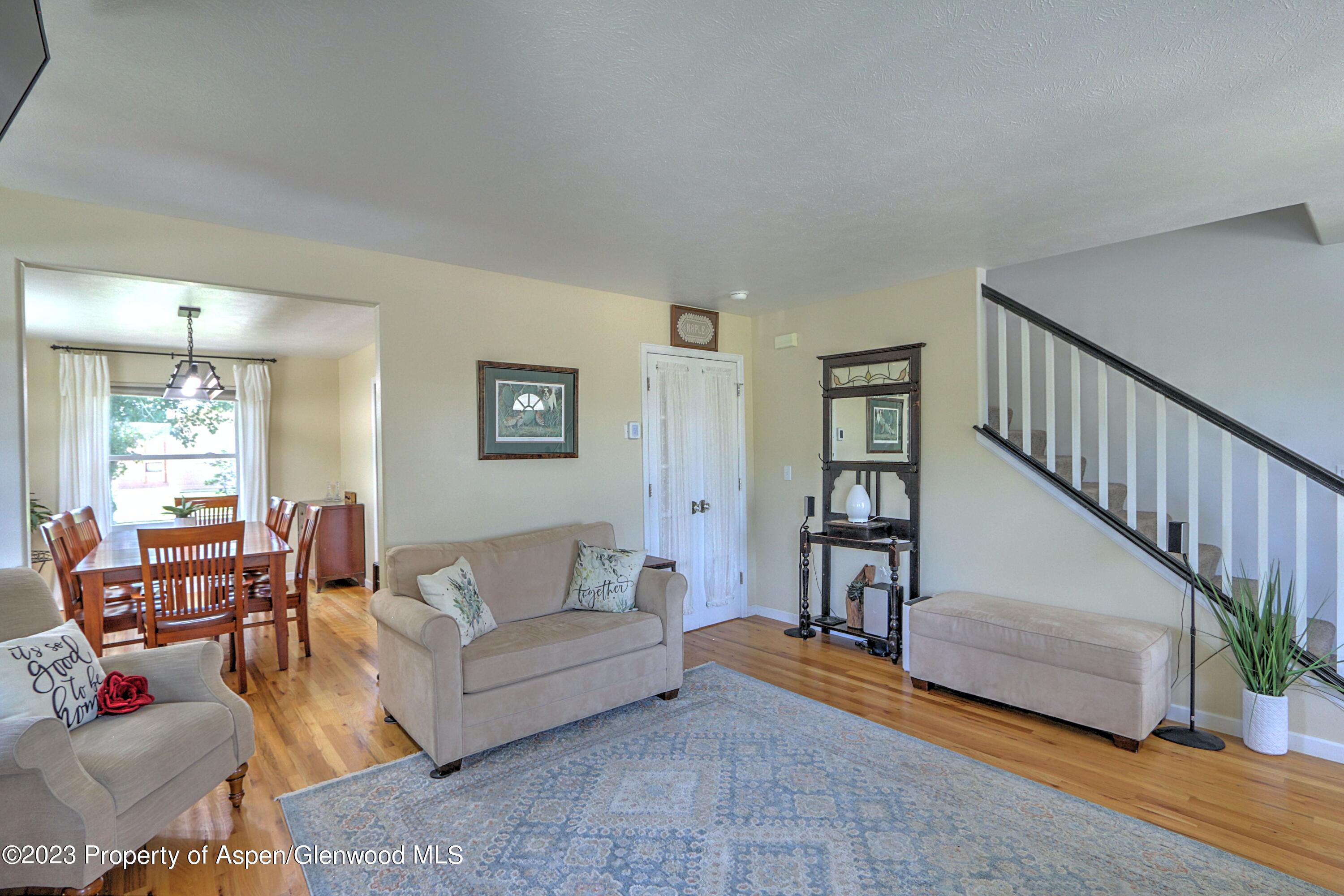 1527 Graham Court Rifle, CO 81650 - Photo 7 of 32 a living room with furniture and wooden floor