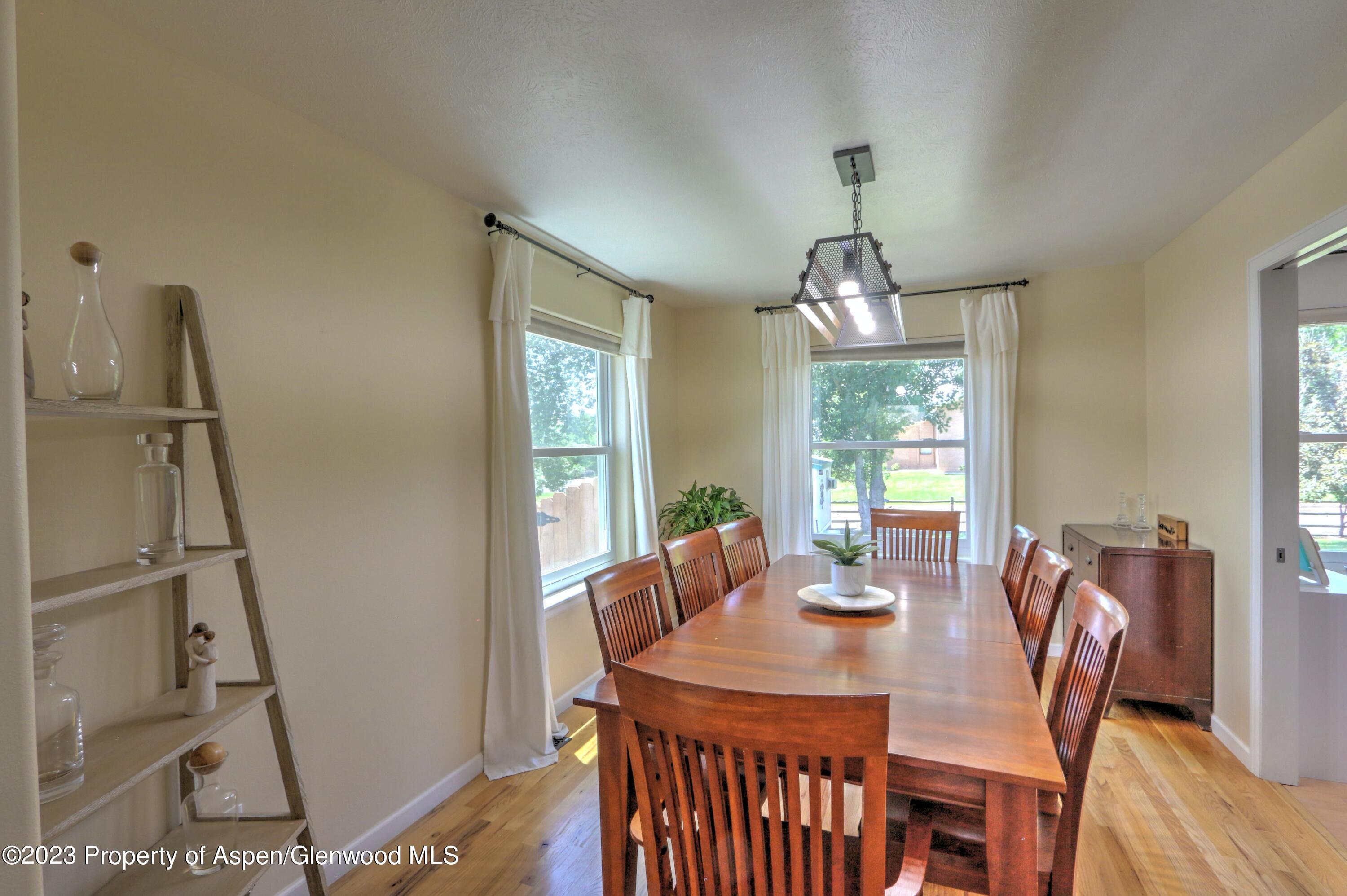 1527 Graham Court Rifle, CO 81650 - Photo 9 of 32 a view of a dining room with furniture window and outside view