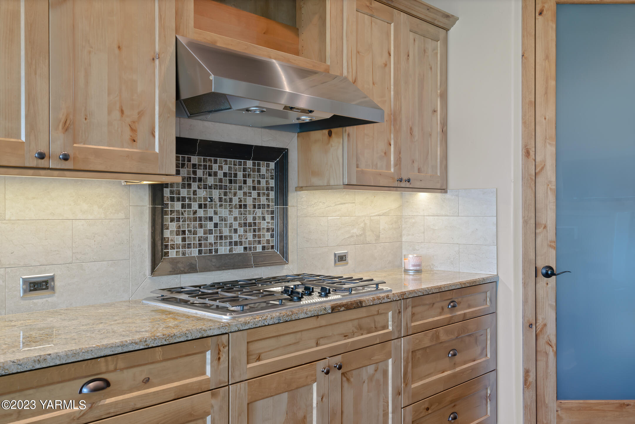 2978 Crosswater Loop Richland, WA 99354 - Photo 13 of 34 a kitchen with granite countertop a stove and a white cabinets