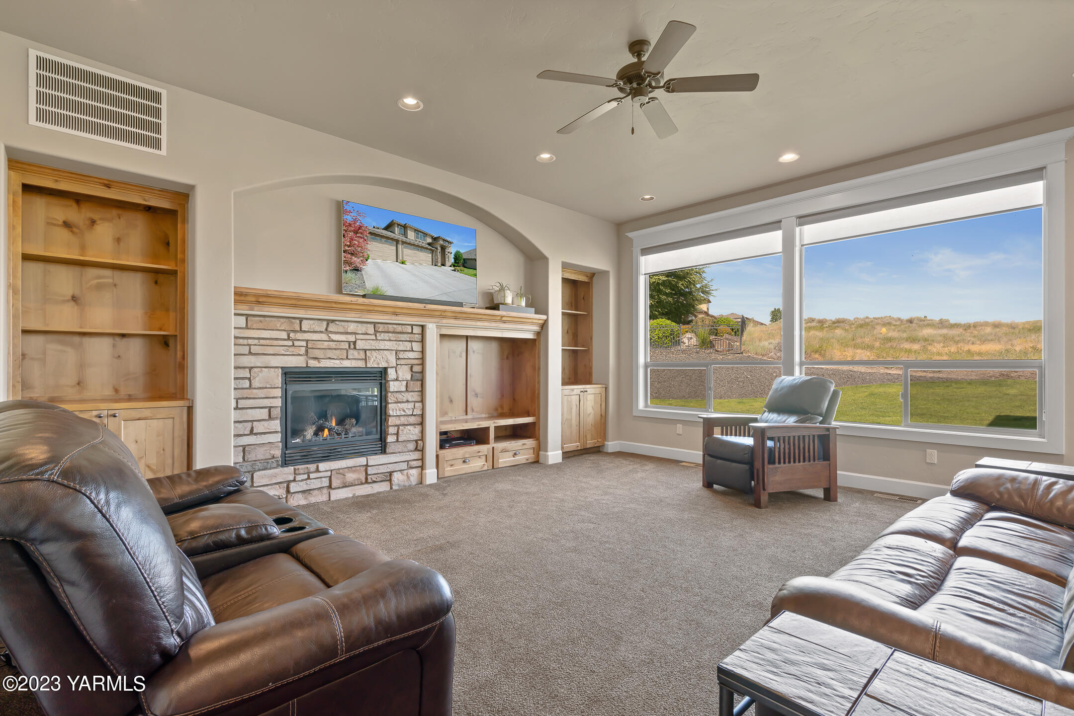 2978 Crosswater Loop Richland, WA 99354 - Photo 18 of 34 a living room with furniture and a fireplace