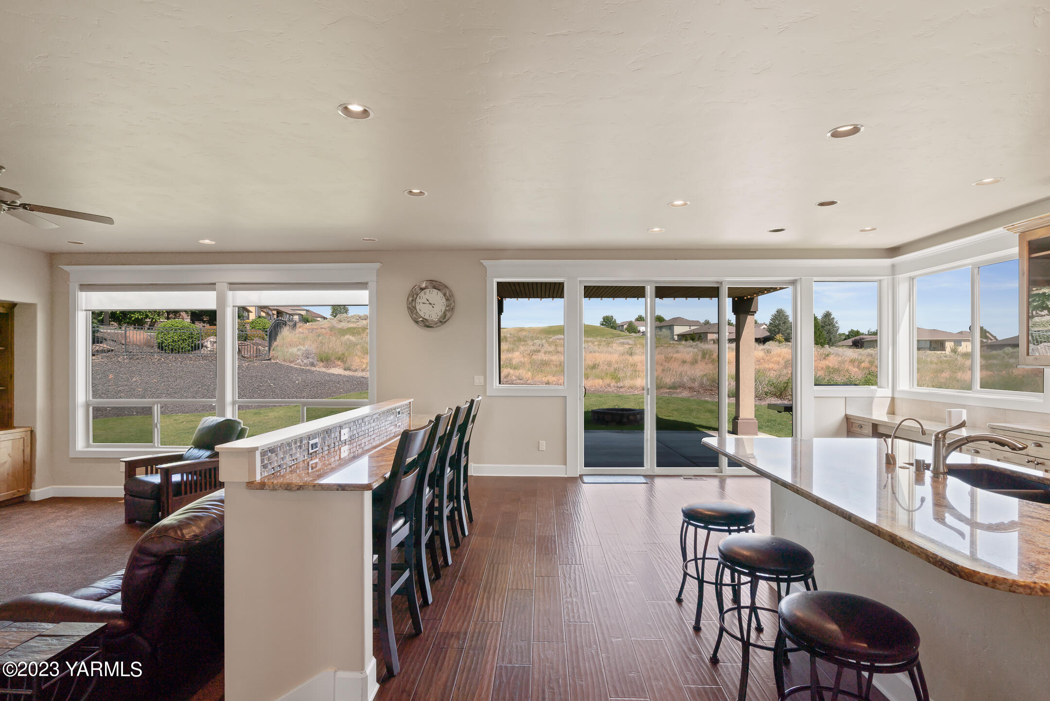 2978 Crosswater Loop Richland, WA 99354 - Photo 8 of 34 a view of a dining room with furniture large windows and wooden floor