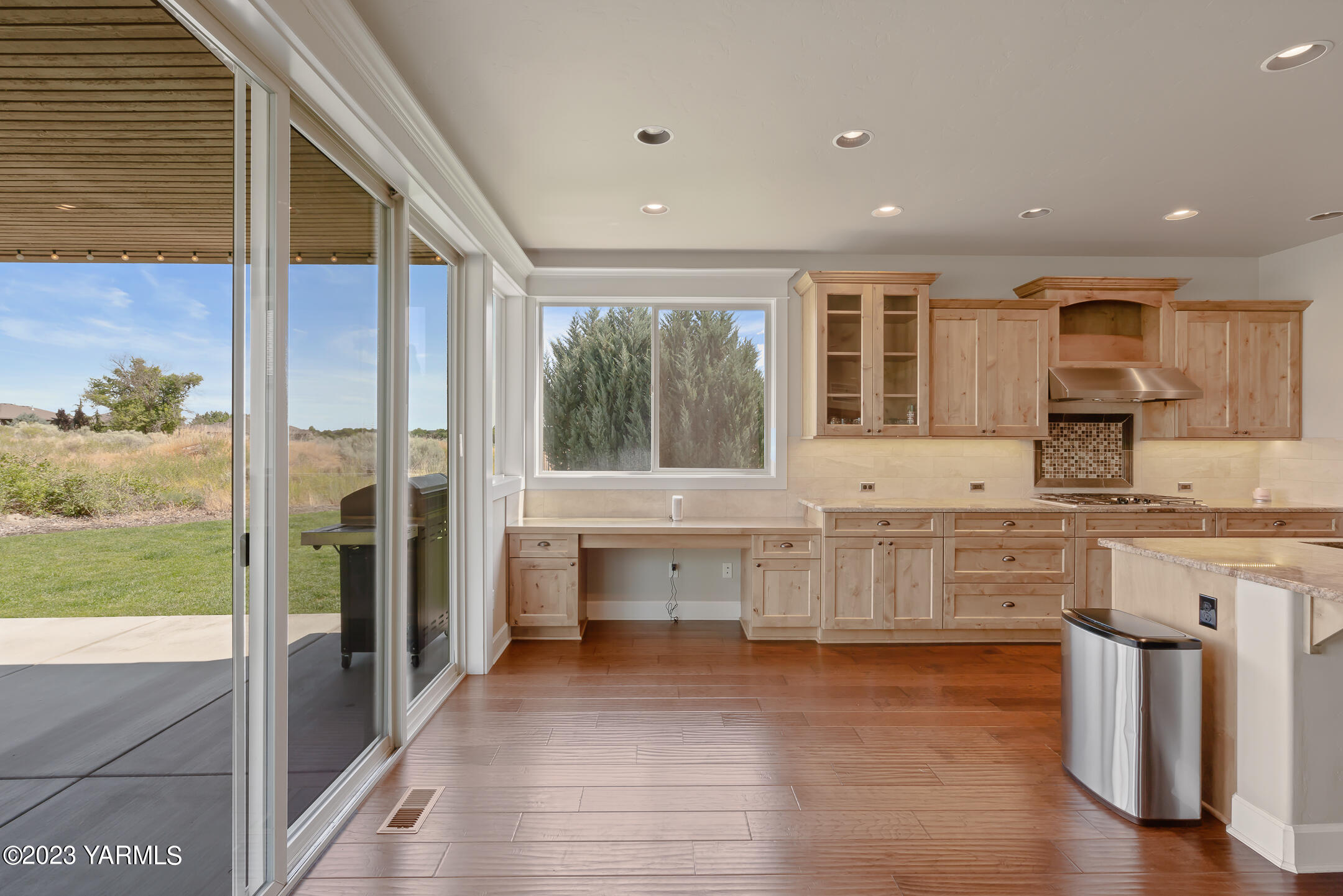 2978 Crosswater Loop Richland, WA 99354 - Photo 10 of 34 a large kitchen with stainless steel appliances wooden floor and a view of living room