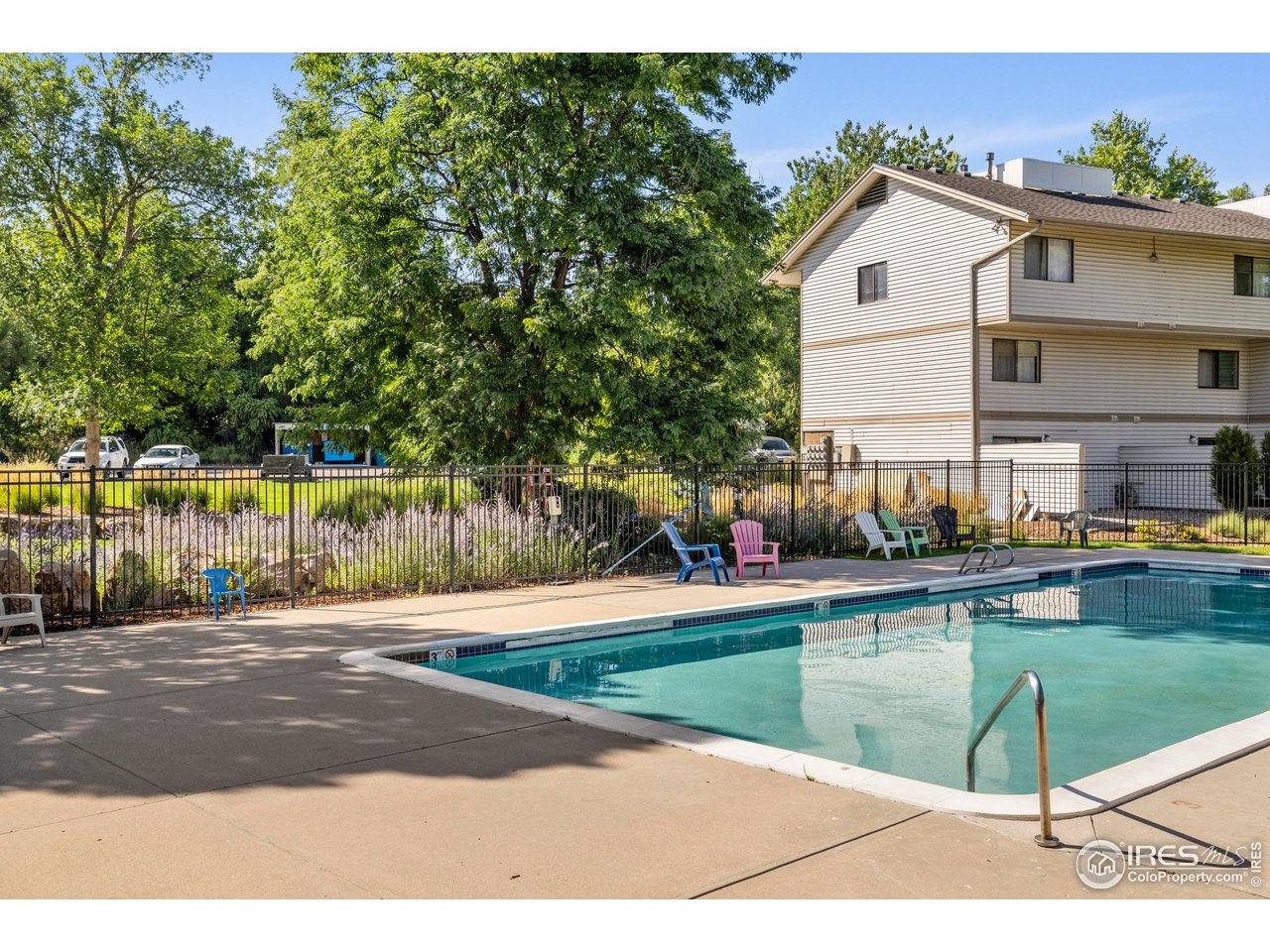 1705 Heatheridge Road, Unit E101 Fort Collins, CO 80526 - Photo 20 of 23 a view of a house with a swimming pool