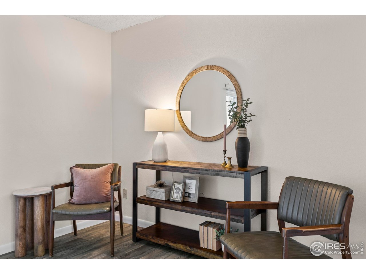 1705 Heatheridge Road, Unit E101 Fort Collins, CO 80526 - Photo 3 of 23 a living room with furniture a mirror and a table