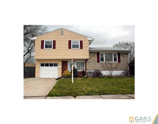 17 Monaghan Road Edison, NJ 08817 - Photo 1 of 25 a front view of a house with a garden