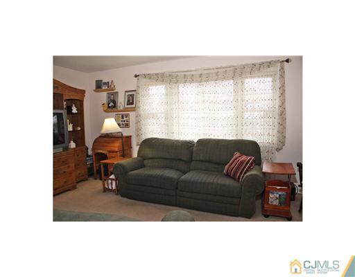 17 Monaghan Road Edison, NJ 08817 - Photo 15 of 25 a living room with furniture and a large window