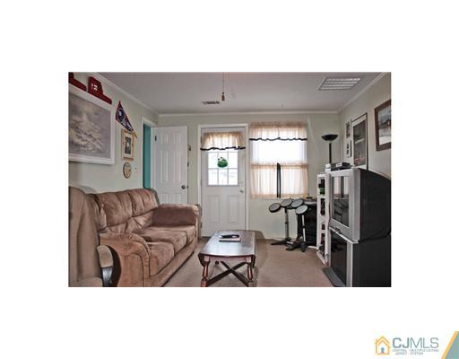 17 Monaghan Road Edison, NJ 08817 - Photo 5 of 25 a living room with furniture and large window