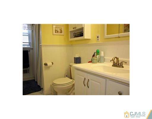 17 Monaghan Road Edison, NJ 08817 - Photo 7 of 25 a bathroom with a sink and a mirror