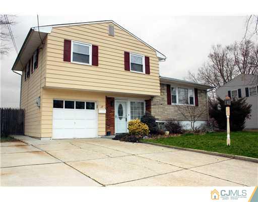 17 Monaghan Road Edison, NJ 08817 - Photo 9 of 25 a front view of a house with a garden
