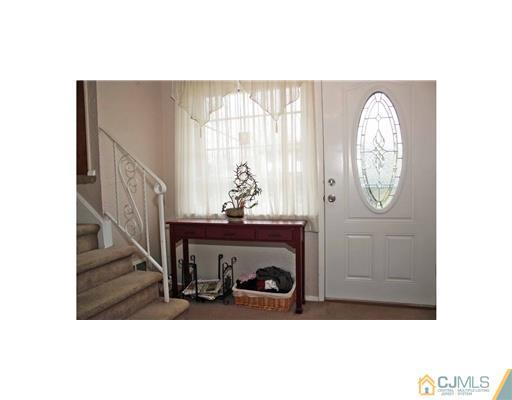 17 Monaghan Road Edison, NJ 08817 - Photo 10 of 25 a view of entryway with wooden floor