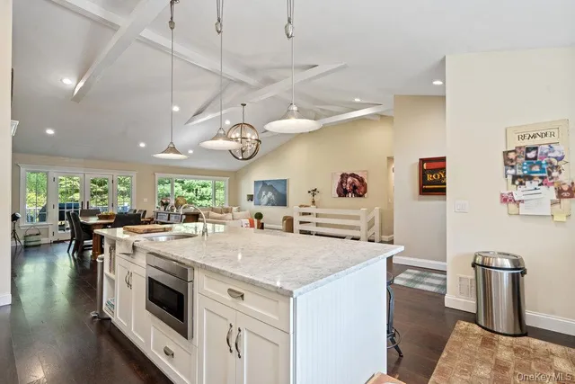 a kitchen with stainless steel appliances granite countertop a stove and a refrigerator