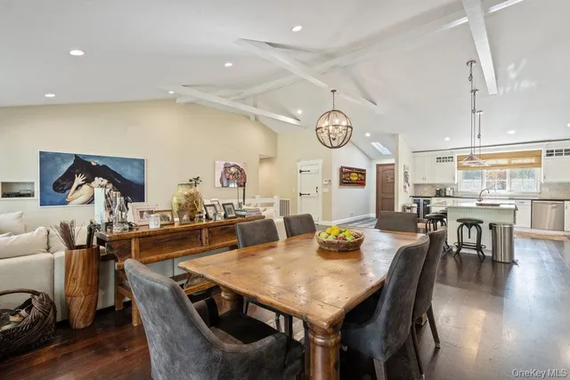 a view of a dining area with furniture and wooden floor