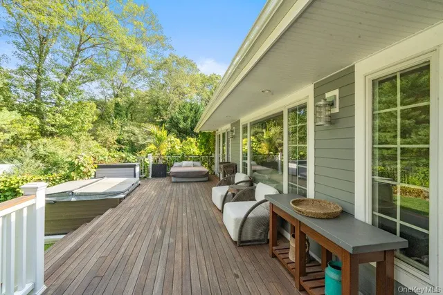 a view of a balcony with couch and wooden floor