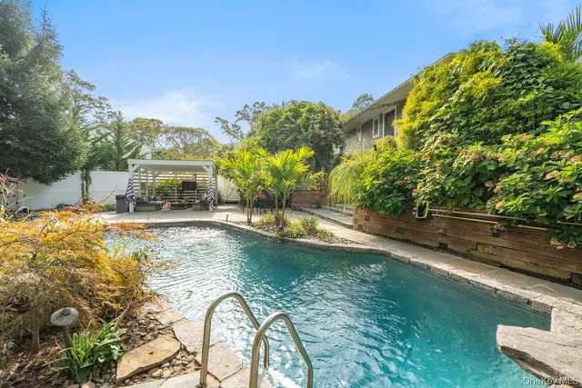 a view of a swimming pool with a patio