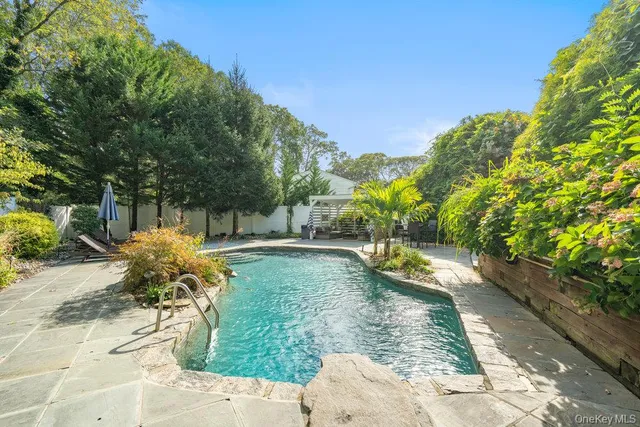 a view of a swimming pool with a patio