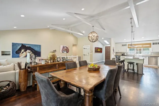 a view of a dining area with furniture and wooden floor