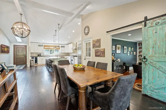 a view of a dining area with furniture and wooden floor