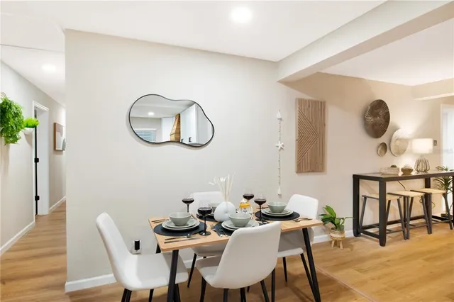 a view of a backyard with swimming pool and sitting area