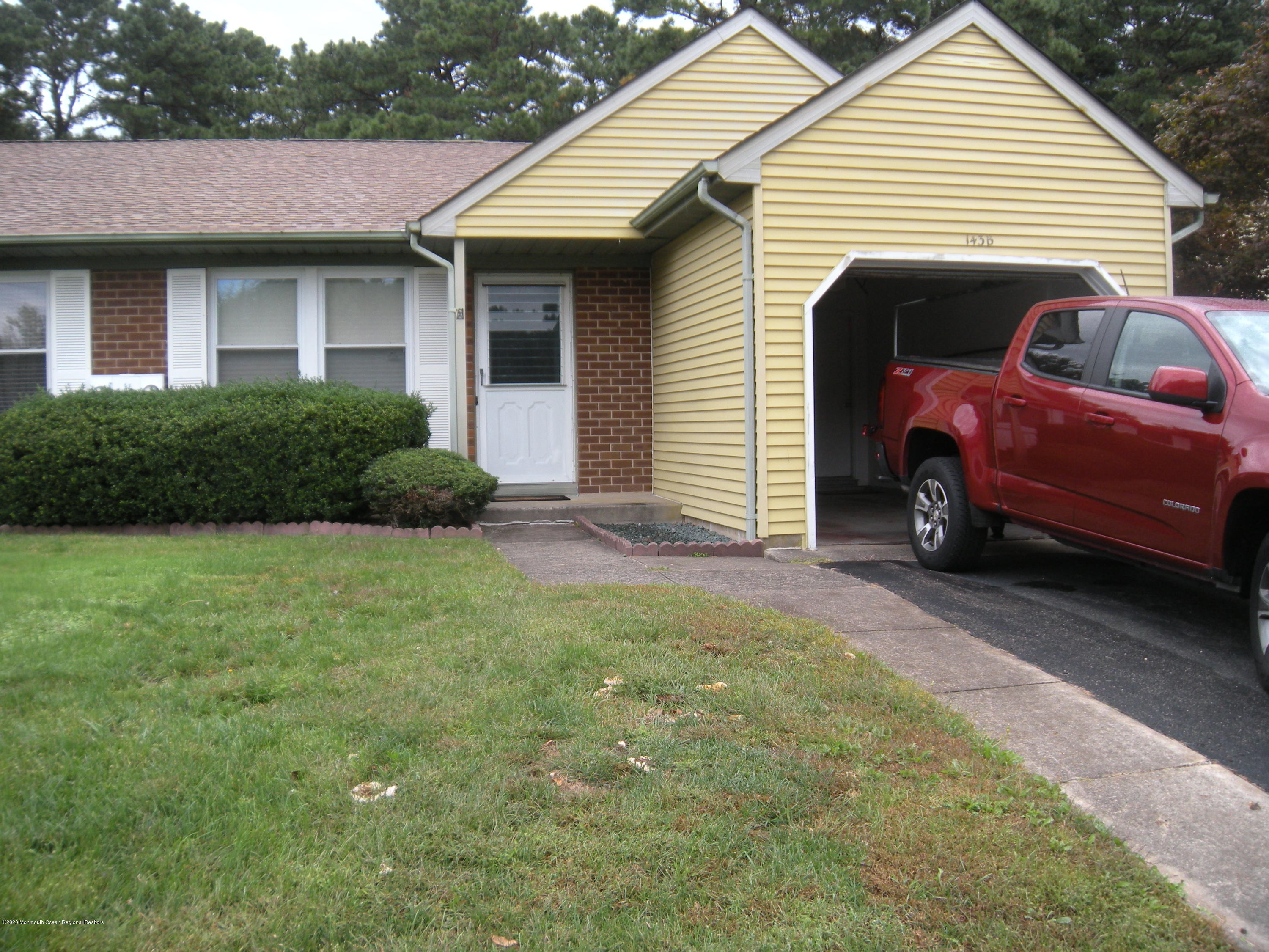 143B Sunset Road, Unit B Whiting, NJ 08759 - Photo 1 of 9 a view of a house with a backyard