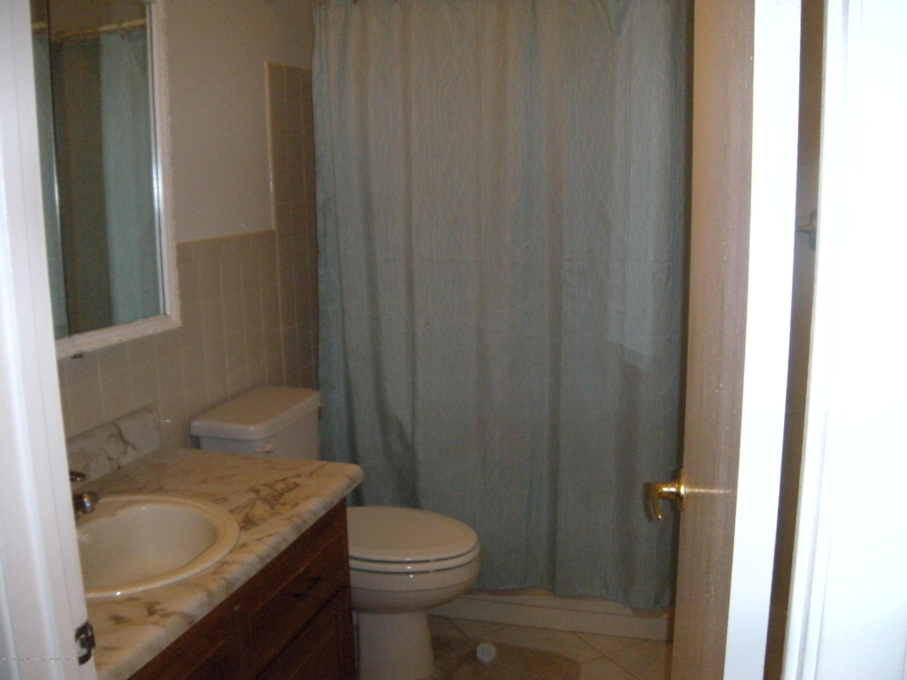 143B Sunset Road, Unit B Whiting, NJ 08759 - Photo 6 of 9 a bathroom with a sink and toilet