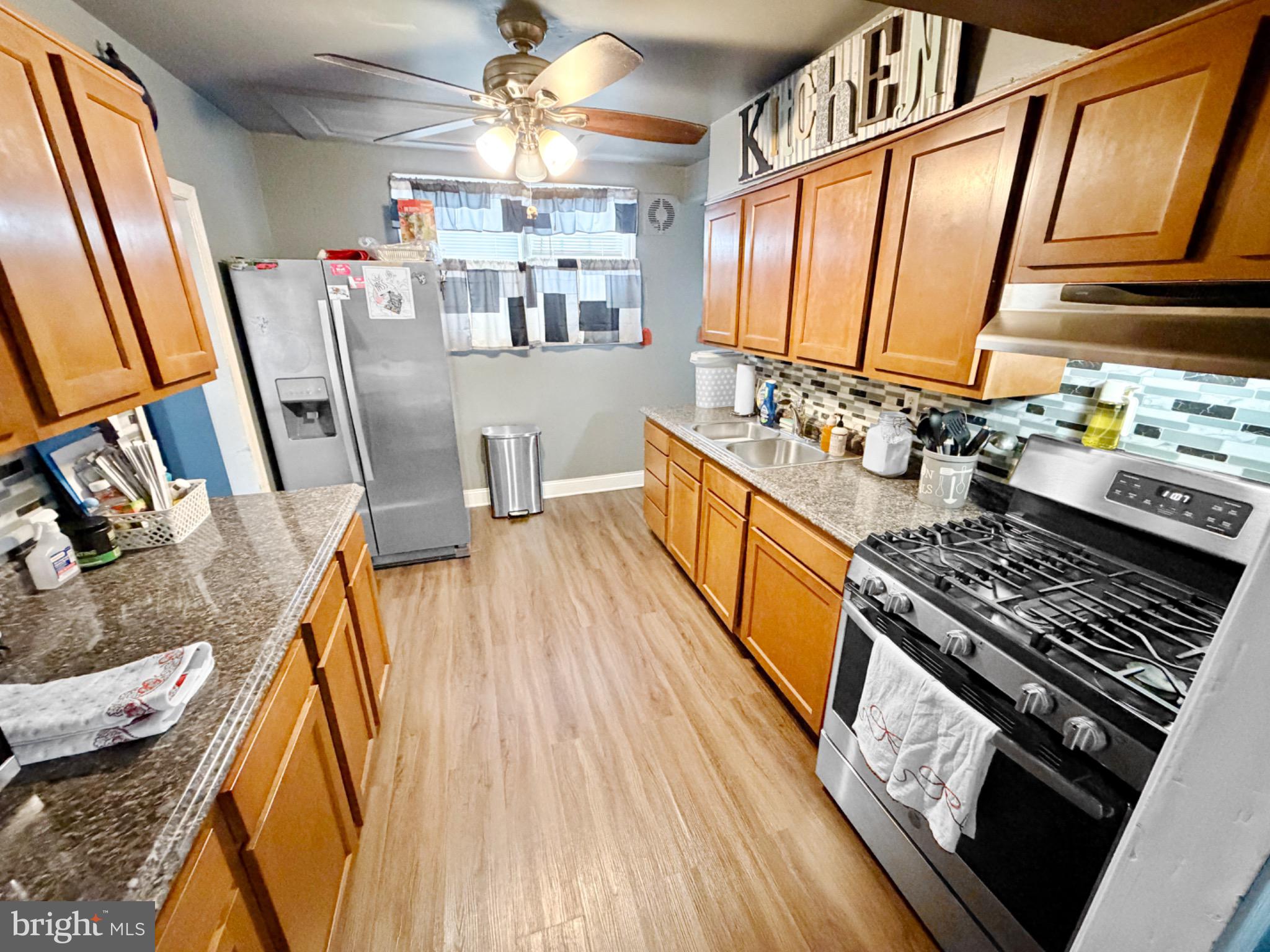15 Mark New Castle, DE 19720 - Photo 5 of 13 Warm and inviting kitchen with modern touches.