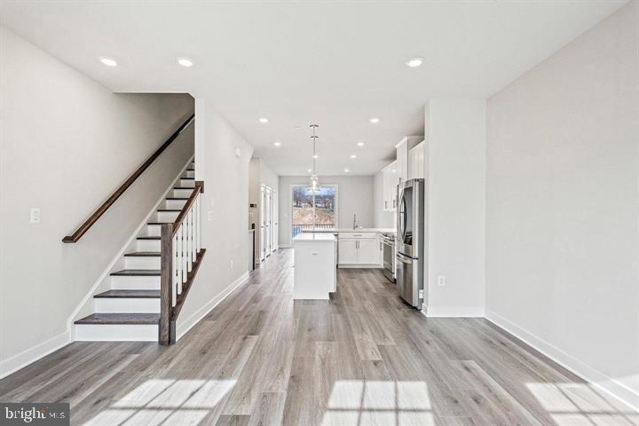 1343 Aspen Street Northwest Washington, DC 20012 - Photo 13 of 24 a view of a kitchen with wooden floor and electronic appliances