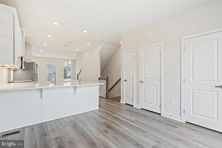 1343 Aspen Street Northwest Washington, DC 20012 - Photo 14 of 24 a view of kitchen with wooden floor and window