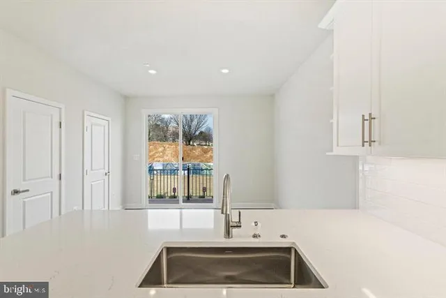 a kitchen that has a sink and a window in it
