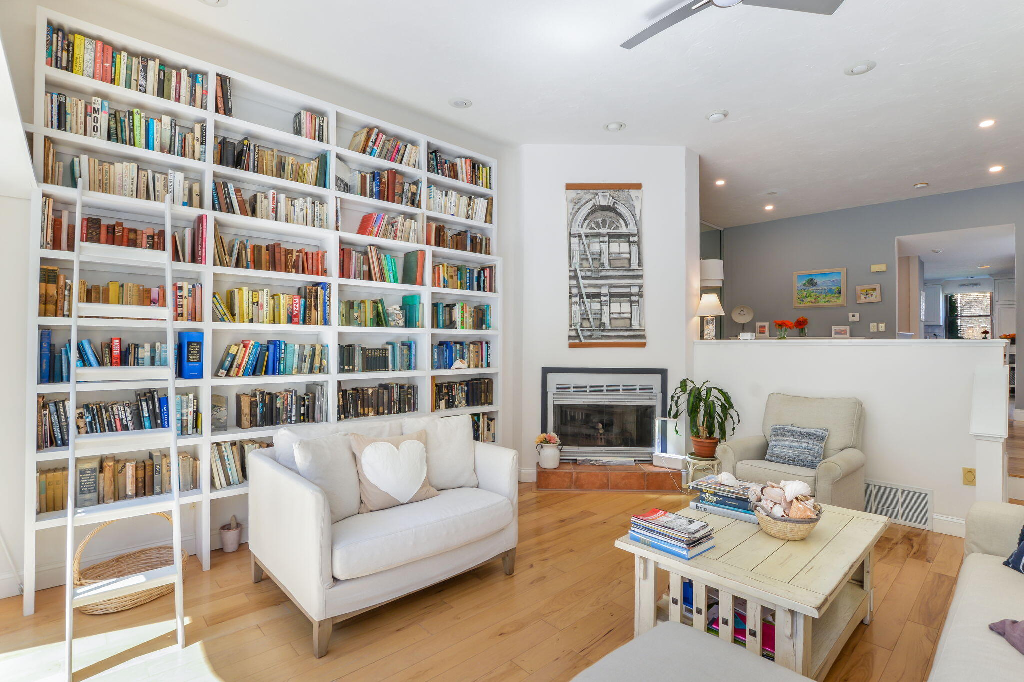 4 Riverview Avenue, Unit G Mashpee, MA 02649 - Photo 11 of 39 a living room with furniture and a book shelf
