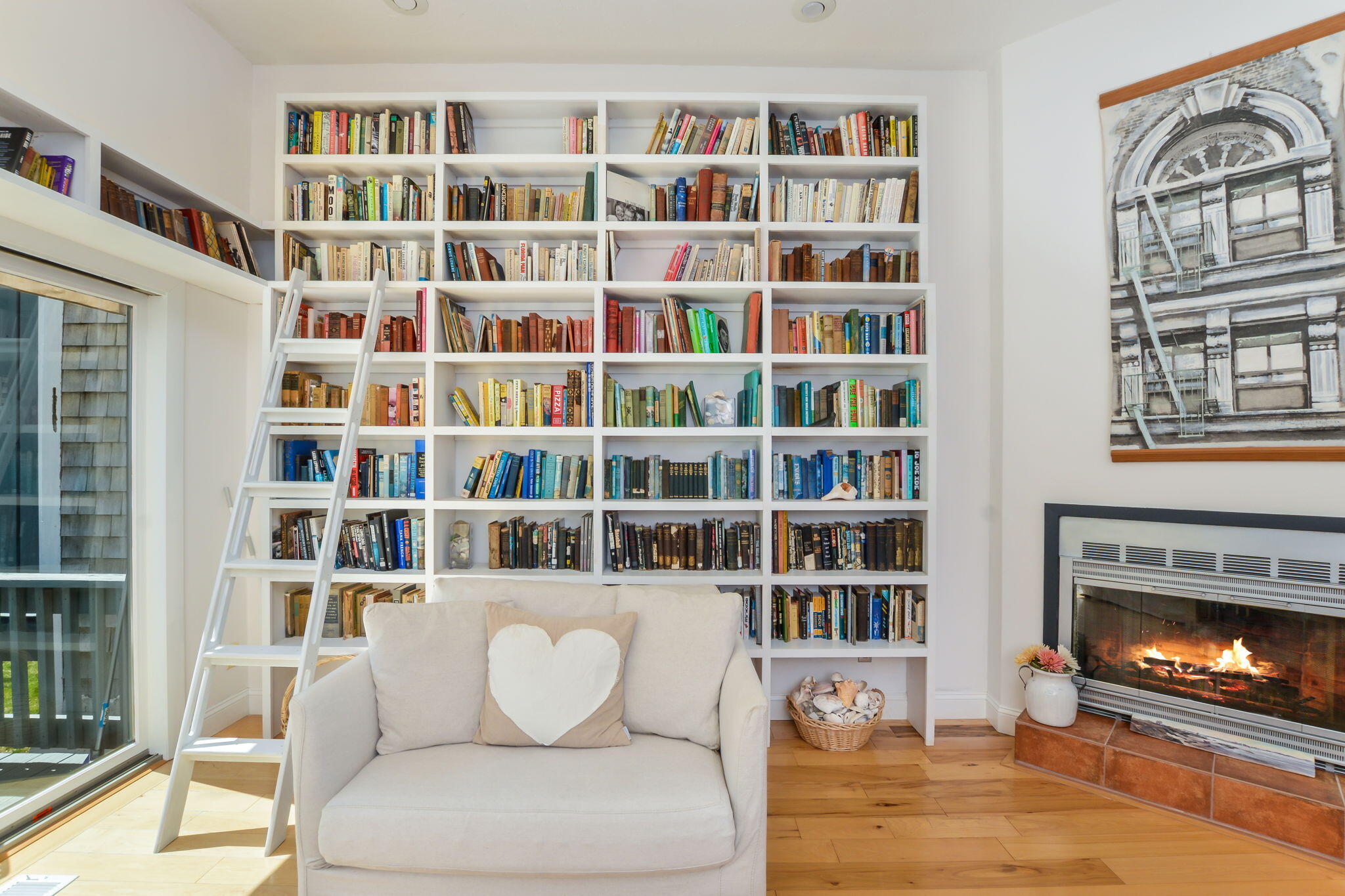 4 Riverview Avenue, Unit G Mashpee, MA 02649 - Photo 12 of 39 a living room with furniture and a book shelf
