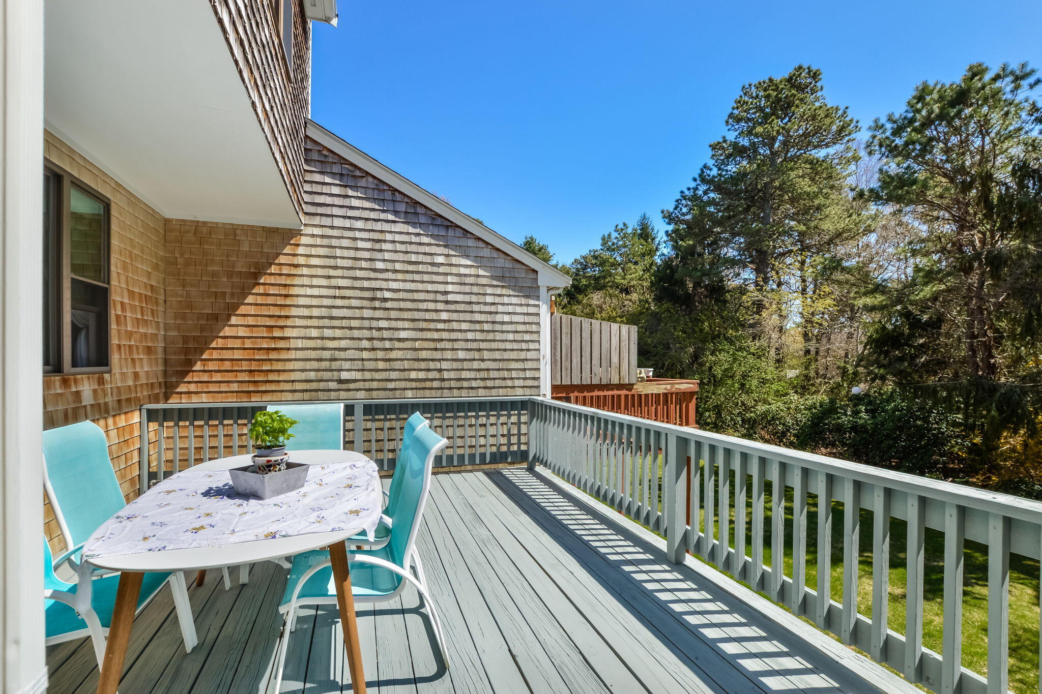 4 Riverview Avenue, Unit G Mashpee, MA 02649 - Photo 14 of 39 a view of a balcony with furniture