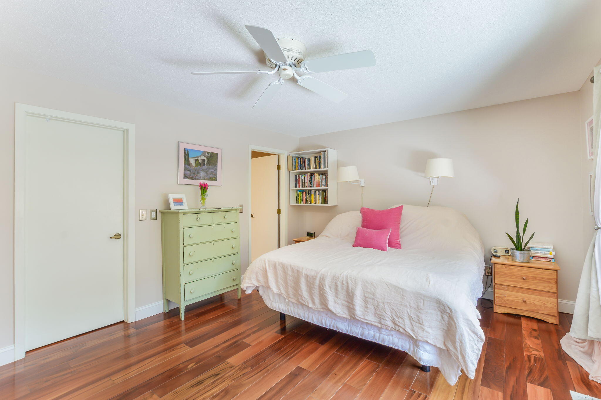 4 Riverview Avenue, Unit G Mashpee, MA 02649 - Photo 19 of 39 a bedroom with a bed and a chandelier