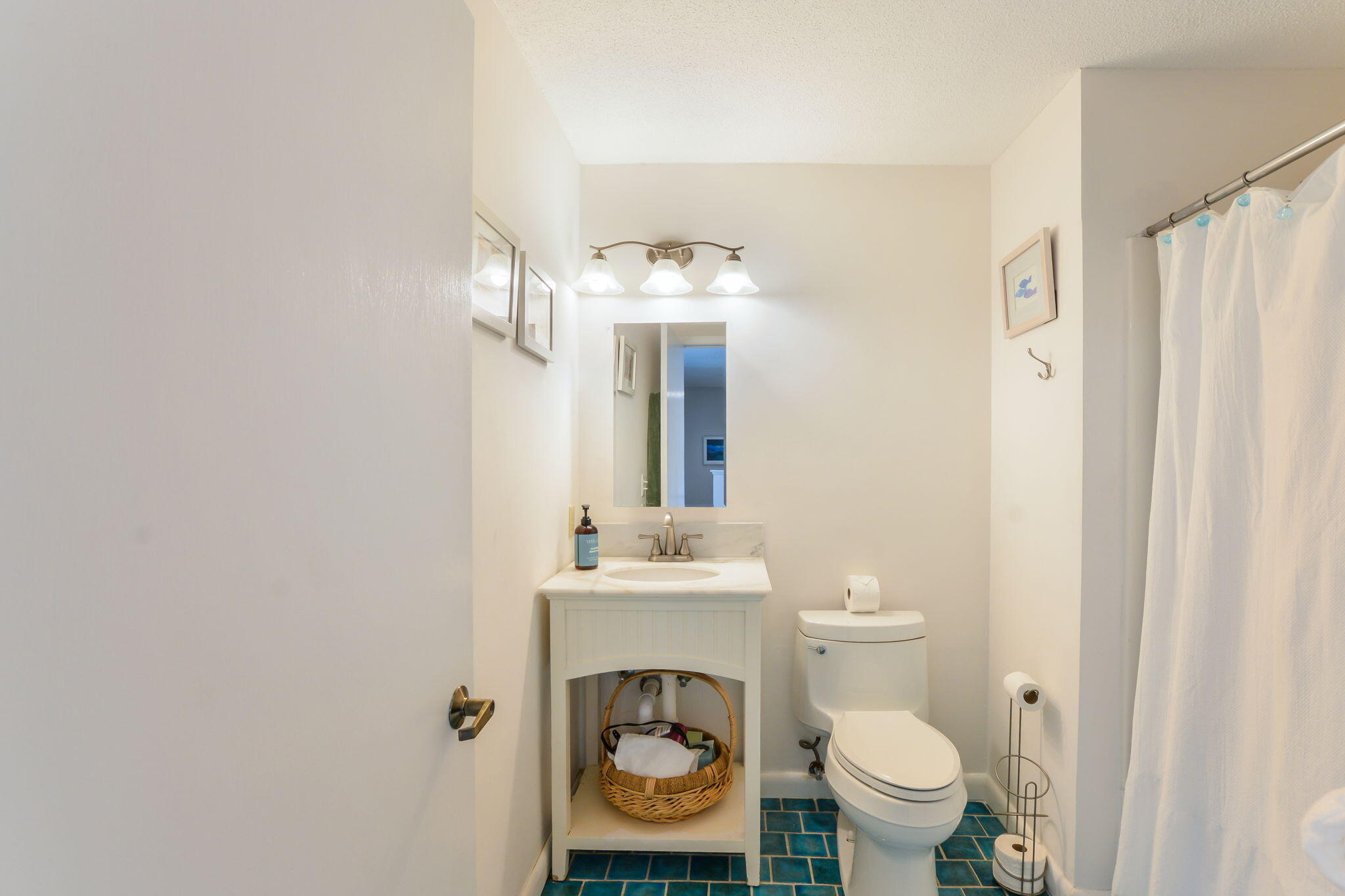 4 Riverview Avenue, Unit G Mashpee, MA 02649 - Photo 24 of 39 a bathroom with a sink mirror vanity and a toilet