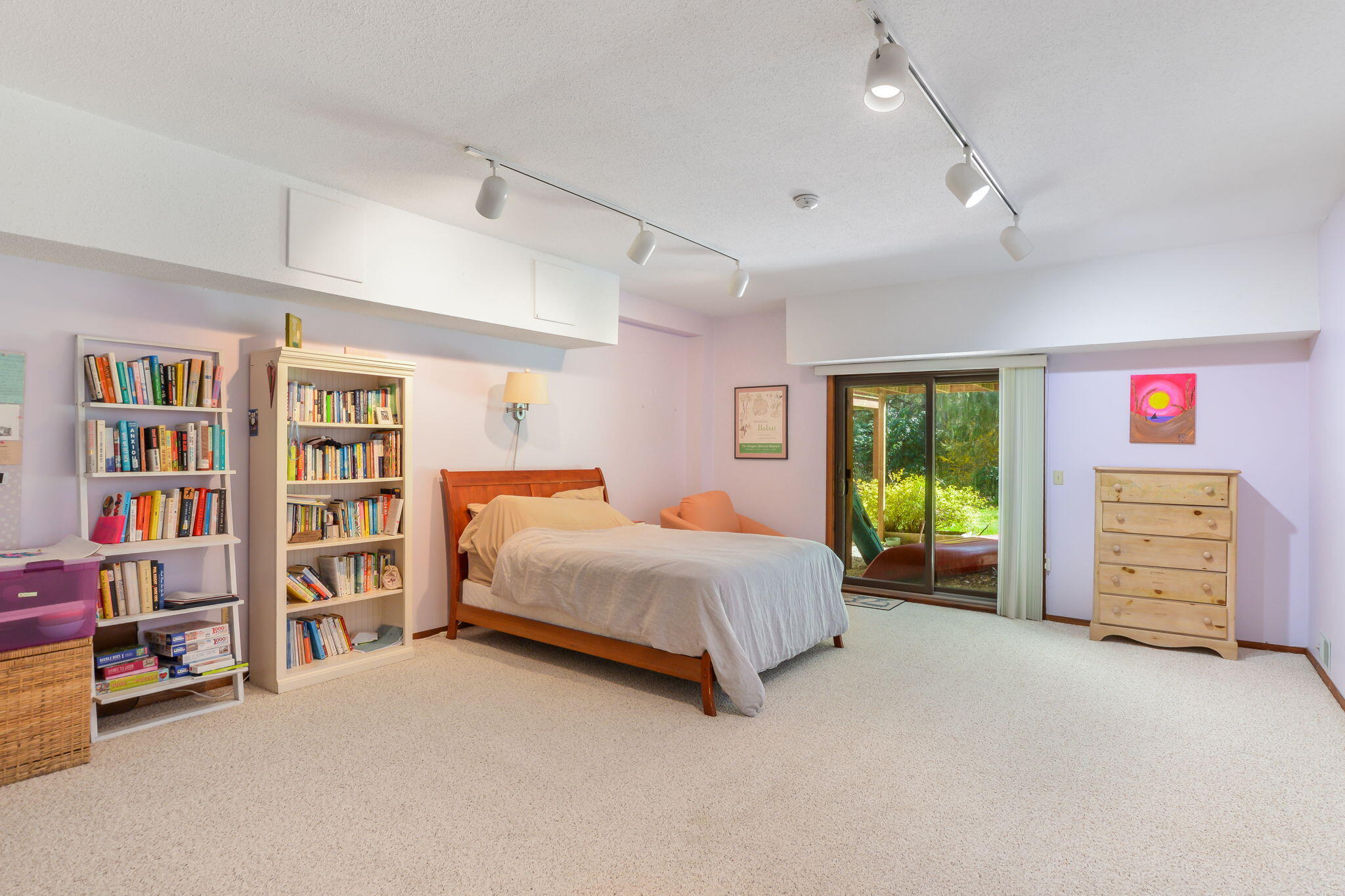 4 Riverview Avenue, Unit G Mashpee, MA 02649 - Photo 27 of 39 a spacious bedroom with a bed a dresser and a book shelf