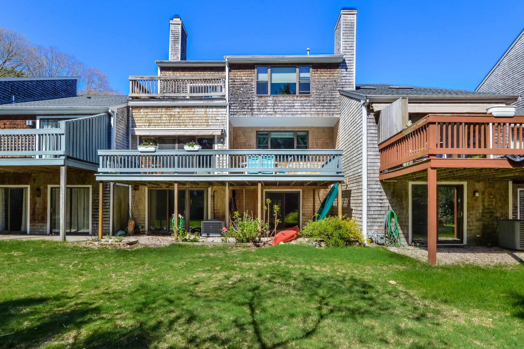 4 Riverview Avenue, Unit G Mashpee, MA 02649 - Photo 29 of 39 a front view of a house with a yard