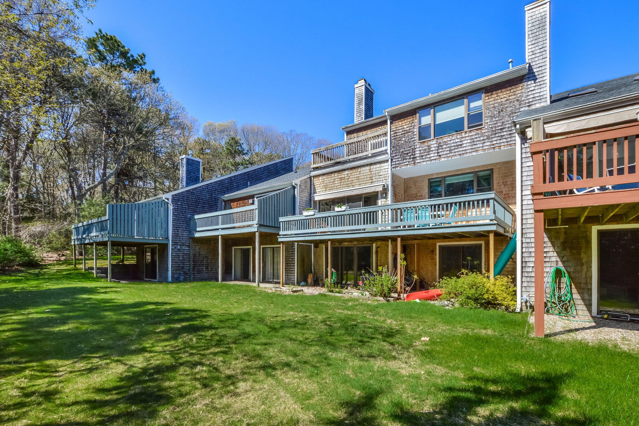 4 Riverview Avenue, Unit G Mashpee, MA 02649 - Photo 30 of 39 a view of a house with a yard