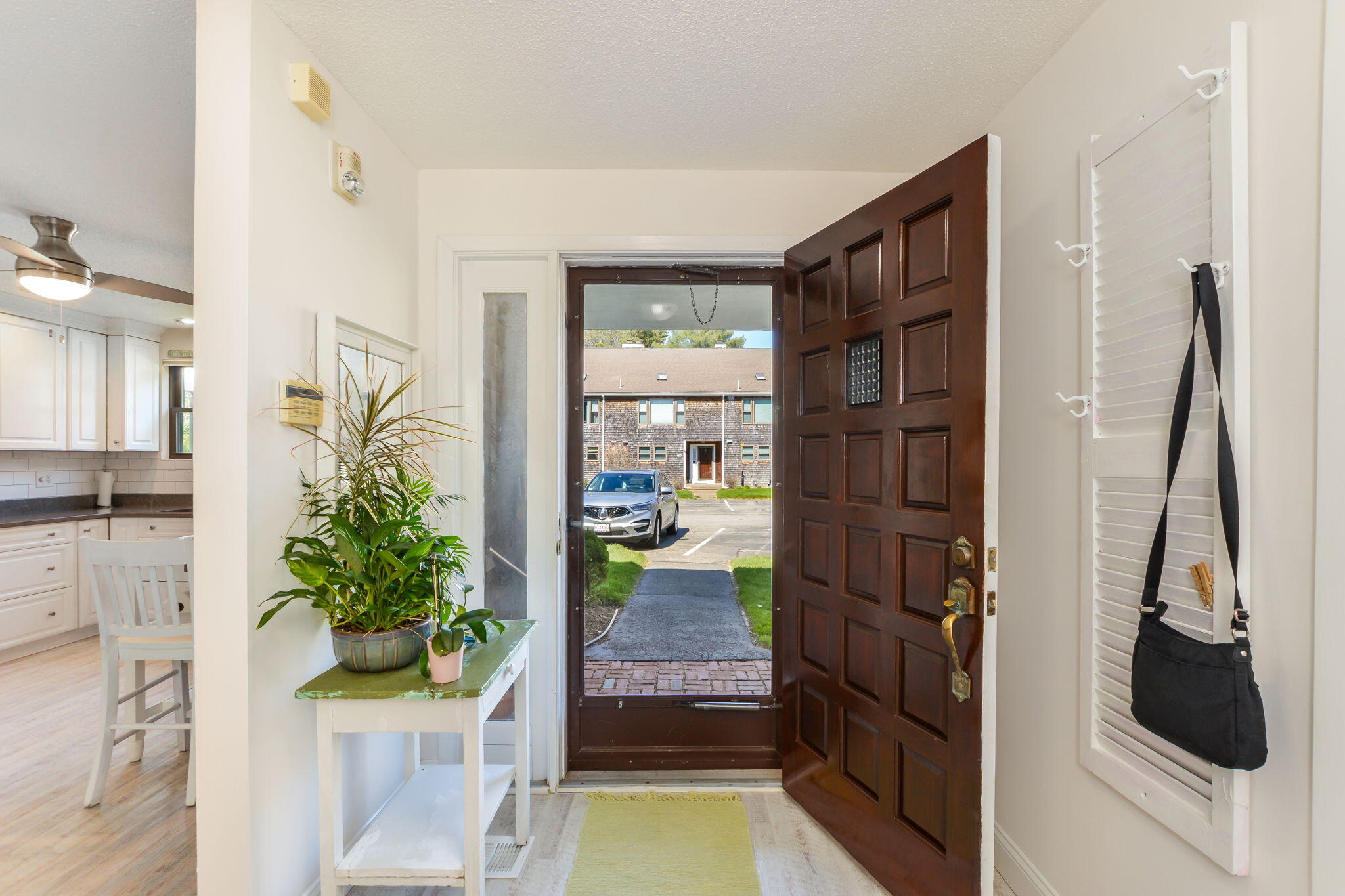 4 Riverview Avenue, Unit G Mashpee, MA 02649 - Photo 6 of 39 a living room with furniture and a floor to ceiling window