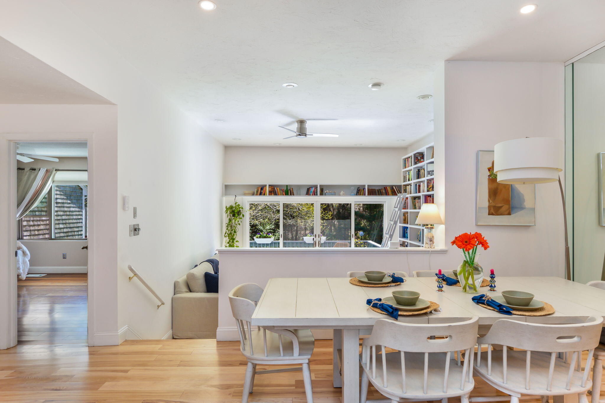 4 Riverview Avenue, Unit G Mashpee, MA 02649 - Photo 9 of 39 a view of a dining room with furniture large window and wooden floor