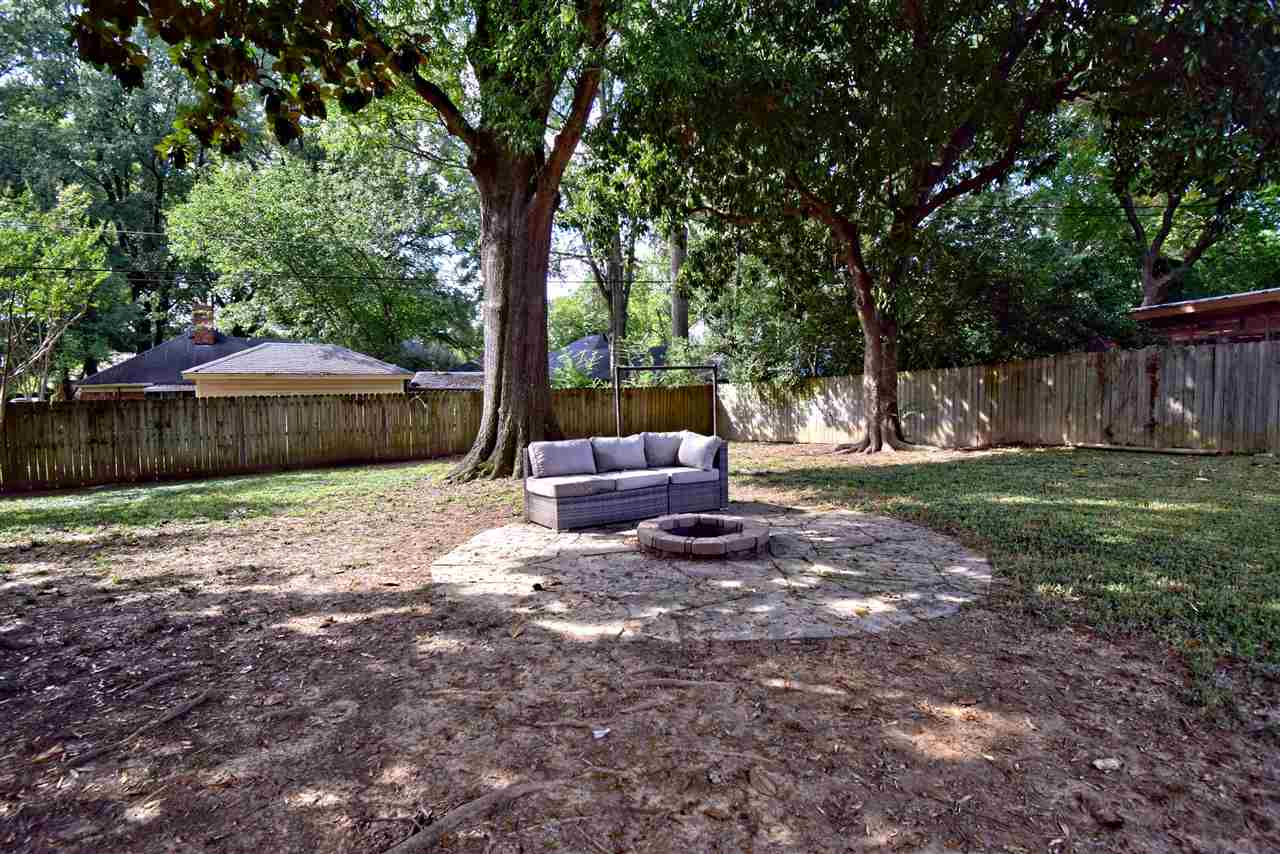 1065 Ivy Road Memphis, TN 38117 - Photo 20 of 20 a view of a house with backyard and a tree