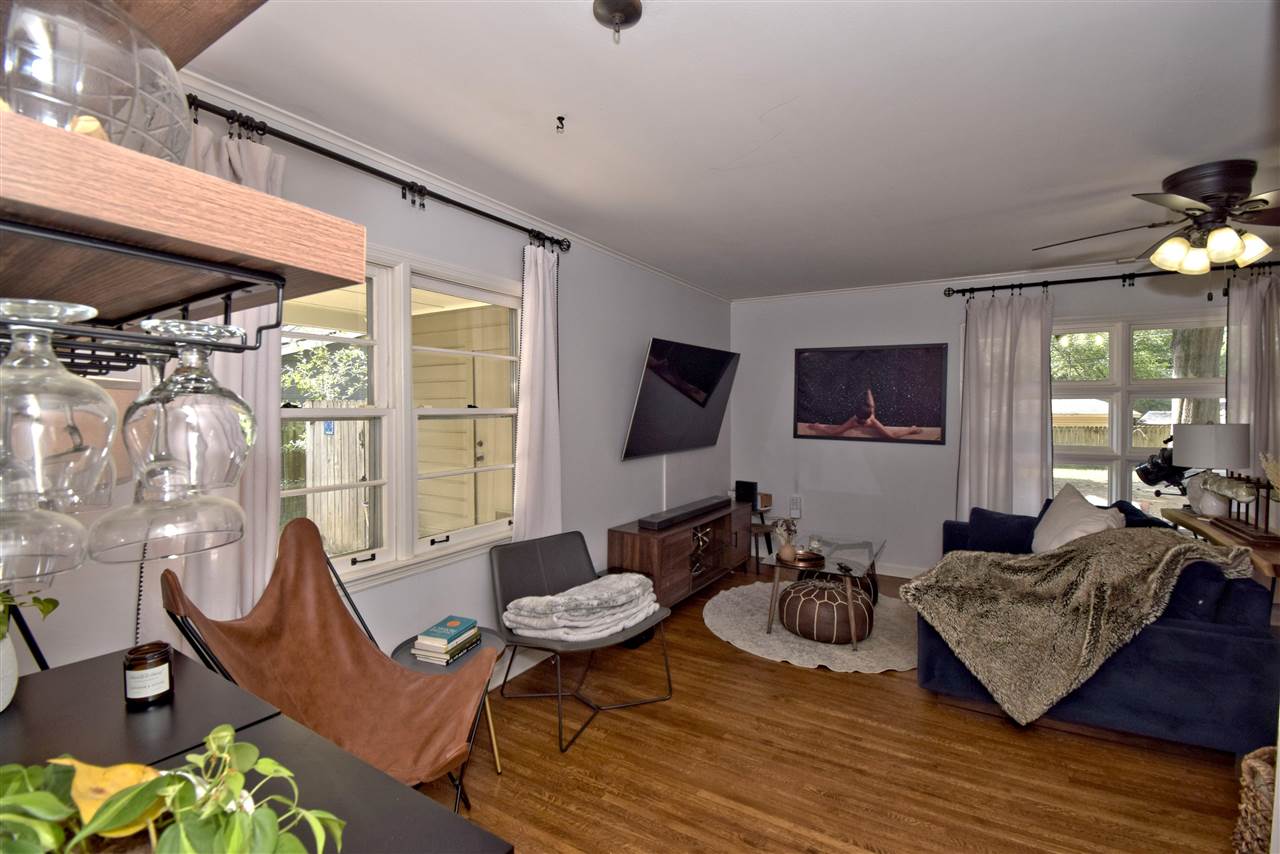 1065 Ivy Road Memphis, TN 38117 - Photo 5 of 20 a living room with furniture a lamp wooden floor and a large window