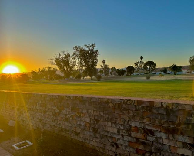1395 Lause Road Bullhead City, AZ 86442 - Photo 31 of 34 Expansive golf course view featuring manicured greens and distant mountains
