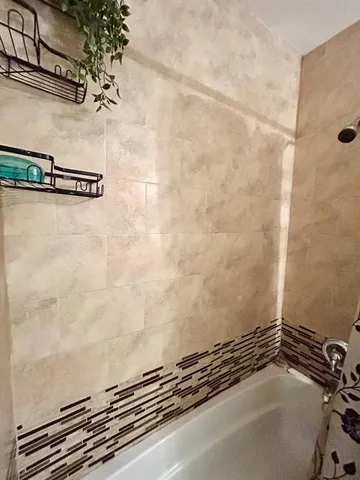 a view of sink and mirror