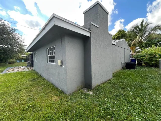 a front view of a house with a yard and porch