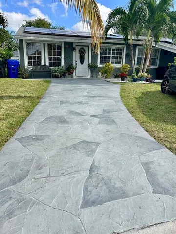 a front view of a house with sitting area and garden