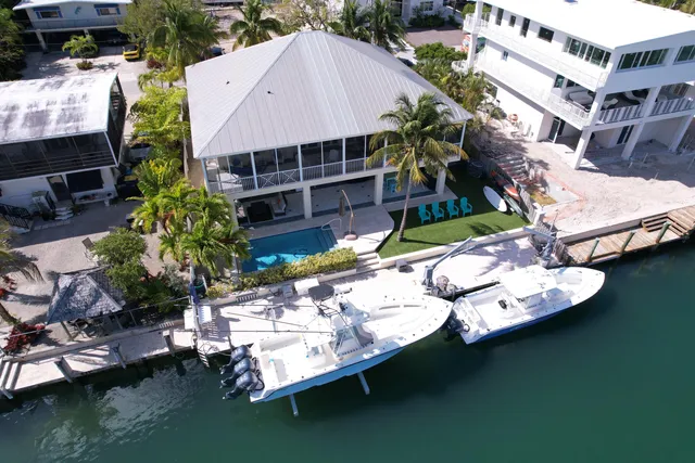 a aerial view of a house with pool patio and outdoor seating