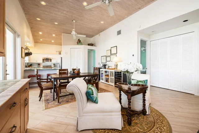 a kitchen with stainless steel appliances granite countertop a sink and a refrigerator