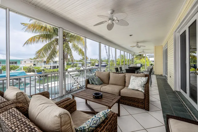 a bedroom with a large bed and a large window